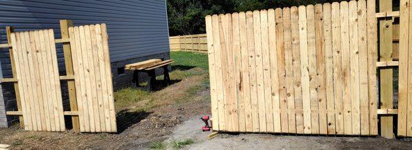 The gates being installed on a 345' fence