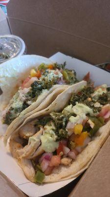 Pollo Tacos, with cheese, chimichurri, and avocado crema.