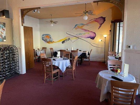 Dining area, with a mural from local tattoo artist