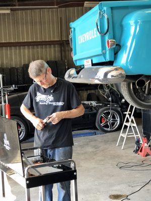 Our mechanic loves classic cars and trucks. He is doing electrical work on this truck.