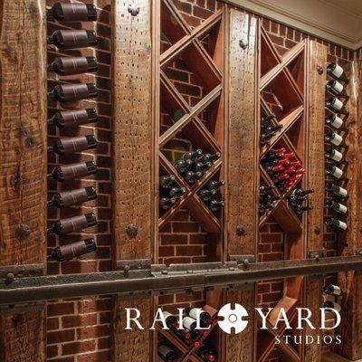 Custom wine cellar installation using authentic railroad timbers and steel.