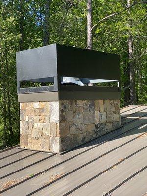 A unique pan and hood on a new house in Gainesville. This house got an outdoor linear fireplace and a wood burning fireplace on the inside.