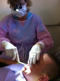 I start everyone off with a toothbrushing. I use a special xylitol rinse when doing this procedure.