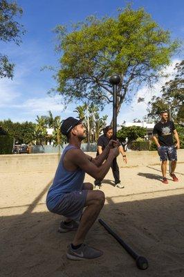 We do a lot of squats. Here's one with a steel mace. The balance and weight placement assists with bettering exercise form.