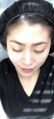 Brow mapping before her microblading procedure.