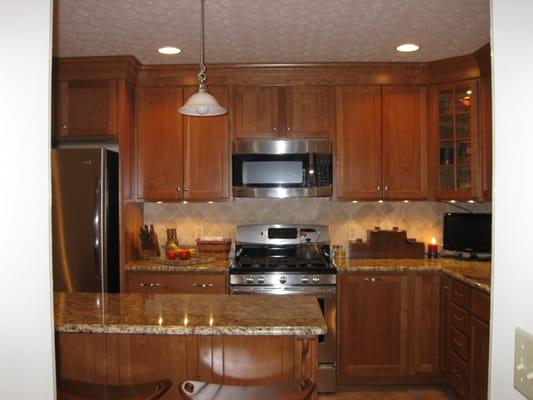 Beautiful new kitchen with cherry cabinets, granite counter tops, and stainless steel appliances