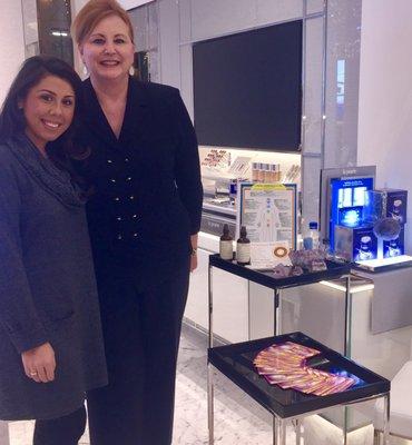 Katarina with the manager of La Prairie cosmetics performing readings at Saks Michigan Ave Beauty Event