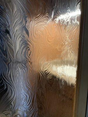 The beautiful glass in the pocket door.