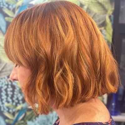 Ginger bob with ribbons of blonde and deep copper. Blunt edge with a bit of softness.