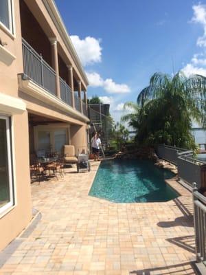 Waterfall feature in front of palms. Pool on the intercostal  Bellair beach