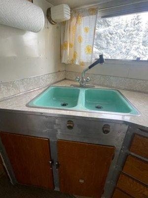 Vintage camper sink refinished in porcelain enamel.