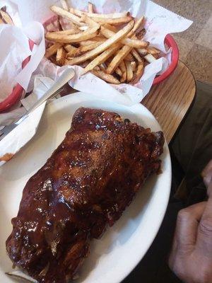 Babyback ribs, served with scrumptious french fries and their delicious coleslaw!