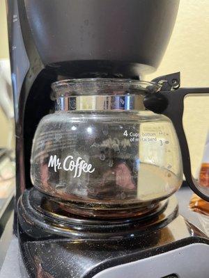 Old coffee from past guest still in coffee pot