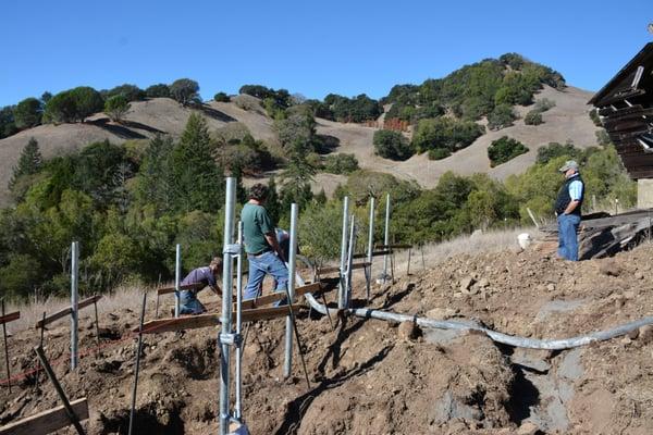 Pouring footings for solar panels.