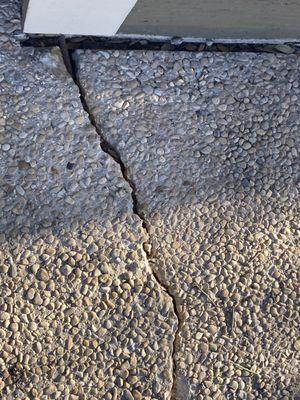 More photos of different cracks, and the aforementioned pebble finish driveway