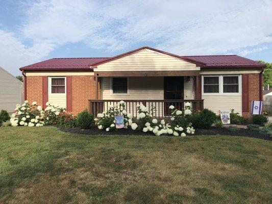 House after new roof, siding, gutters & downspouts