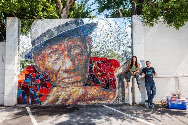 The Mosaic Workshop founders J Muzacz and Carmen Rangel with The Grey Ghost mosaic mural in East Austin.