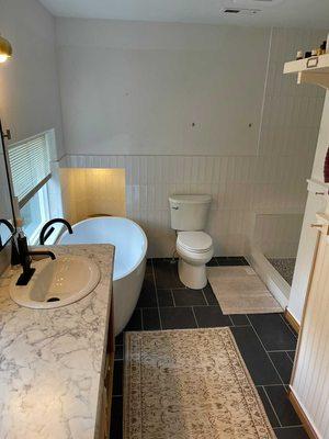 Bathroom remodel. 

Tile flooring, tiled shower and wall, countertops, and painting .