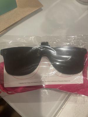 T-Mobile Tuesday giveaway item, a solar eclipse sunglass clip with a polarized sunglass.