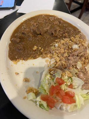 Carne guisada plate with half of it eaten already before I took the pic.