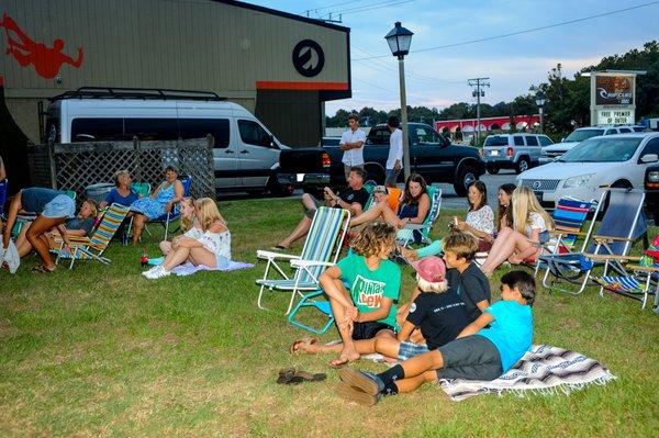 Premiere of Logan Marshall's surf film "OUTER" in the side yard of Outer Banks Boarding Company.