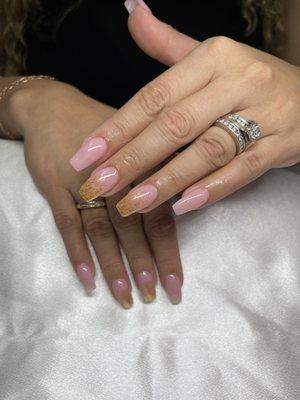 Overlay on her natural nails with a little gold at the tip