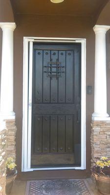 Refinished front door, with doggie scratch pad added.Also home body and columns cut in from the exterior paint project completed.