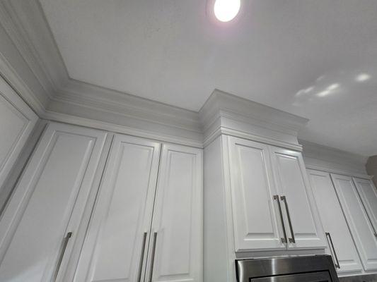 Jason extended our cabinets to the ceiling. Trim, molding, and extension pieces were all added by Jason.