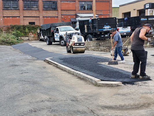 New asphalt pavement  repaired in Malden MA