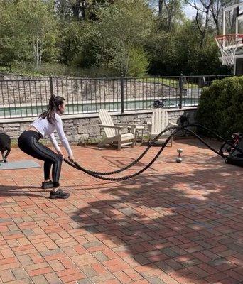 One of our clients slamming the battle ropes.