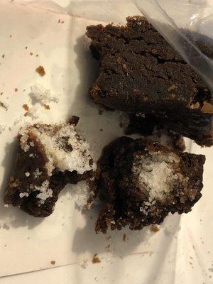 Brownie with (thank god) a clump of White substance that is grainy, and I believe is salt.