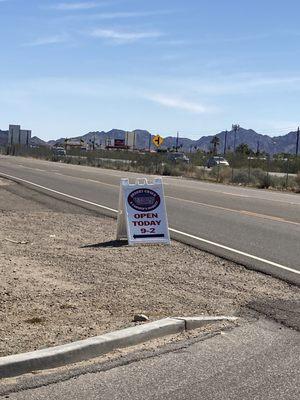 Sign on N Frontage Rd advertising the market