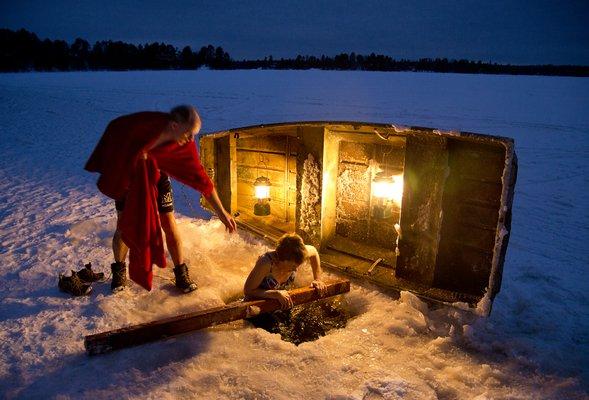 Jumping in a hold in the ice after a sauna