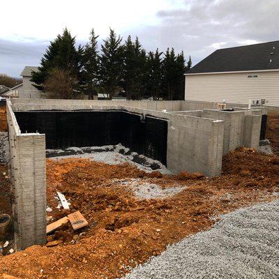 Final product of house foundation and some water proofing. Next is the garage slab/patio/driveway when it's time