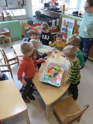 Experimenting with baking soda, vinegar, and liquid watercolors!