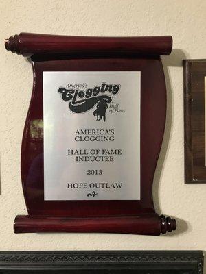 My sister's plaque of her being inducted in the Clogging Hall of Fame in 2013 .