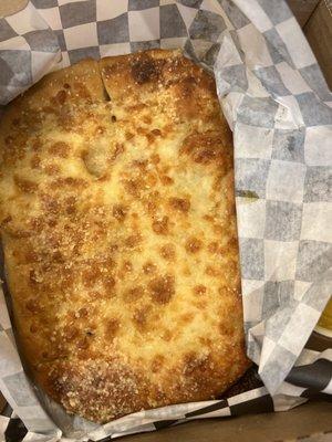 "Fresh cheesy day old bread".