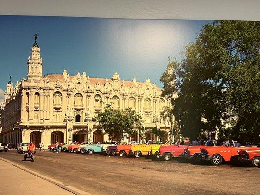 Look at those colorful cars! The building in Havana is French.