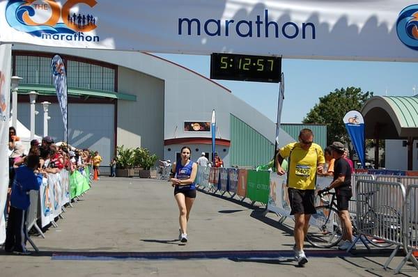 A DetermiNation runner is cheered on by the crowd while approaching the finish line at the 2011 OC Marathoon.