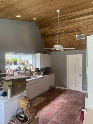 Freshly painted kitchen w/ tongue and groove ceiling.