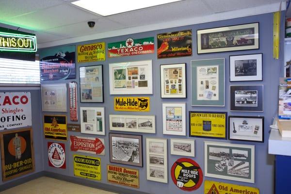 Vintage roofing signs and memorabilia display.