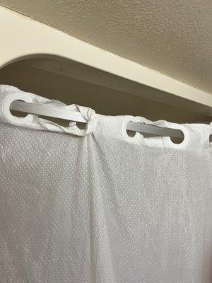 Beat up shower curtain