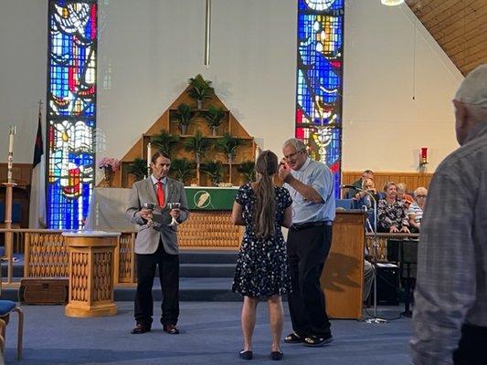 Receiving Communion during the Service.