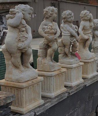 Set of Four Seasons concrete cherubs with pedestals