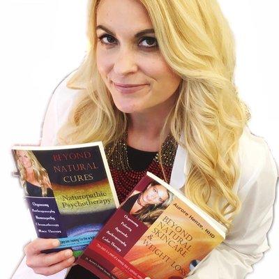 Two of Dr. Aurore's 6 books in her Beyond Natural Cures book series