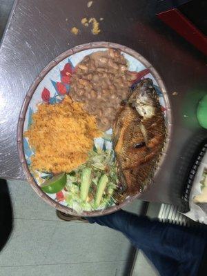 Fried fish with rice beans and salad