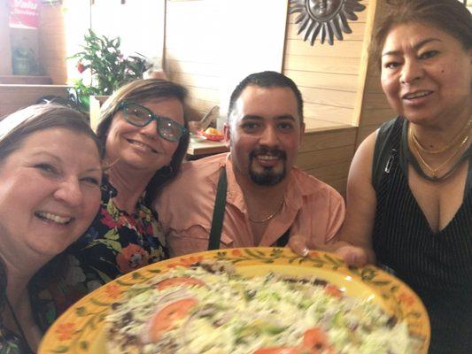 With the cook and waitress who made this ginormous tostada!!!!