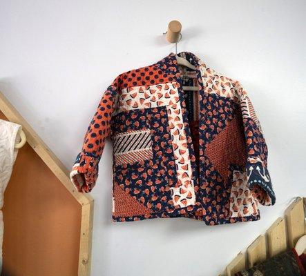 Jacket made out of up-cycled vintage material.