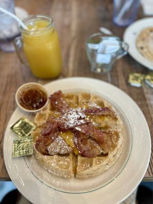 Chicken and Waffles with Cheese, Bacon and a side of Spicy Syrup.