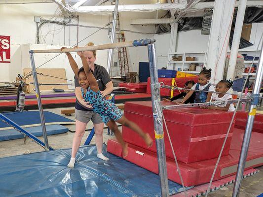 swinging on uneven parallel bars